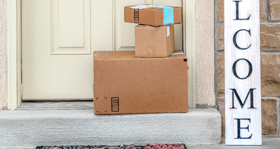 Deliveries on the front porch of a house with a welcome sign in Columbus